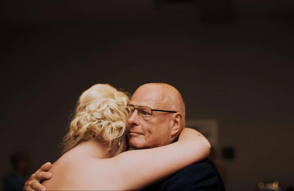 A father hugging his daughter