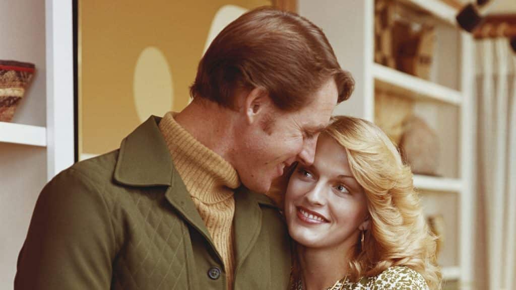 A man and a woman standing next to each other.