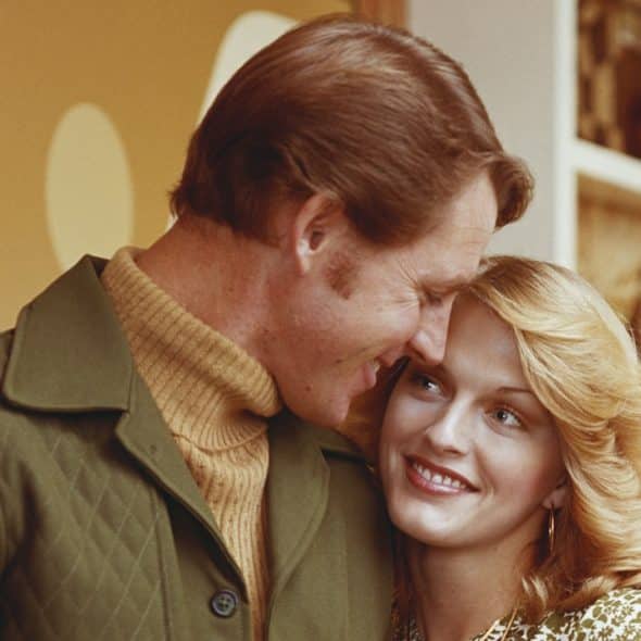 A man and a woman standing next to each other.