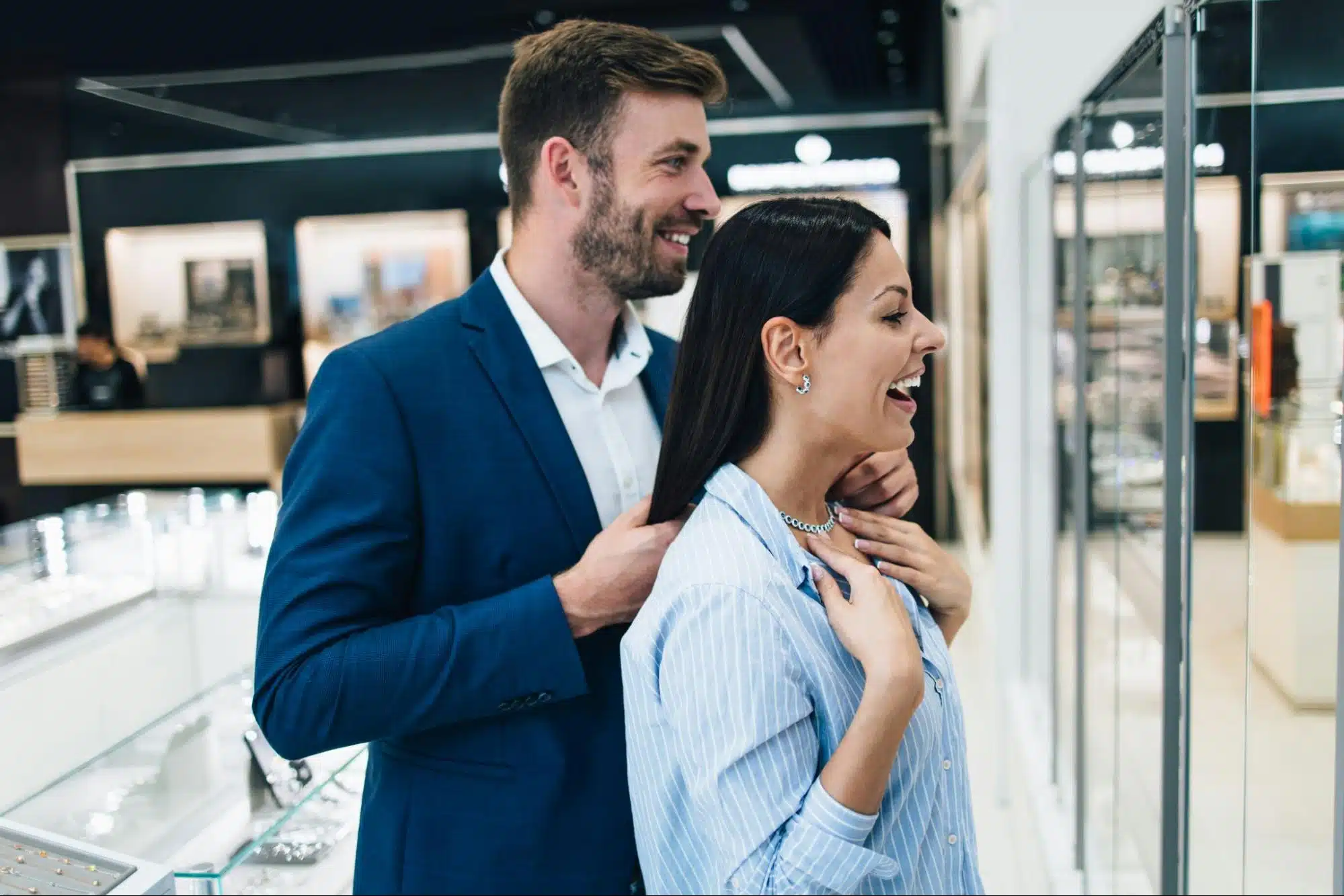A man buying a necklace for woman
