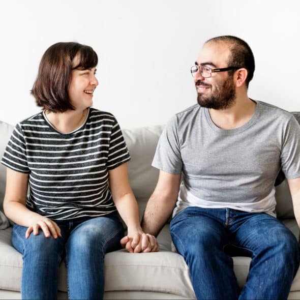 A man and woman looking at each other
