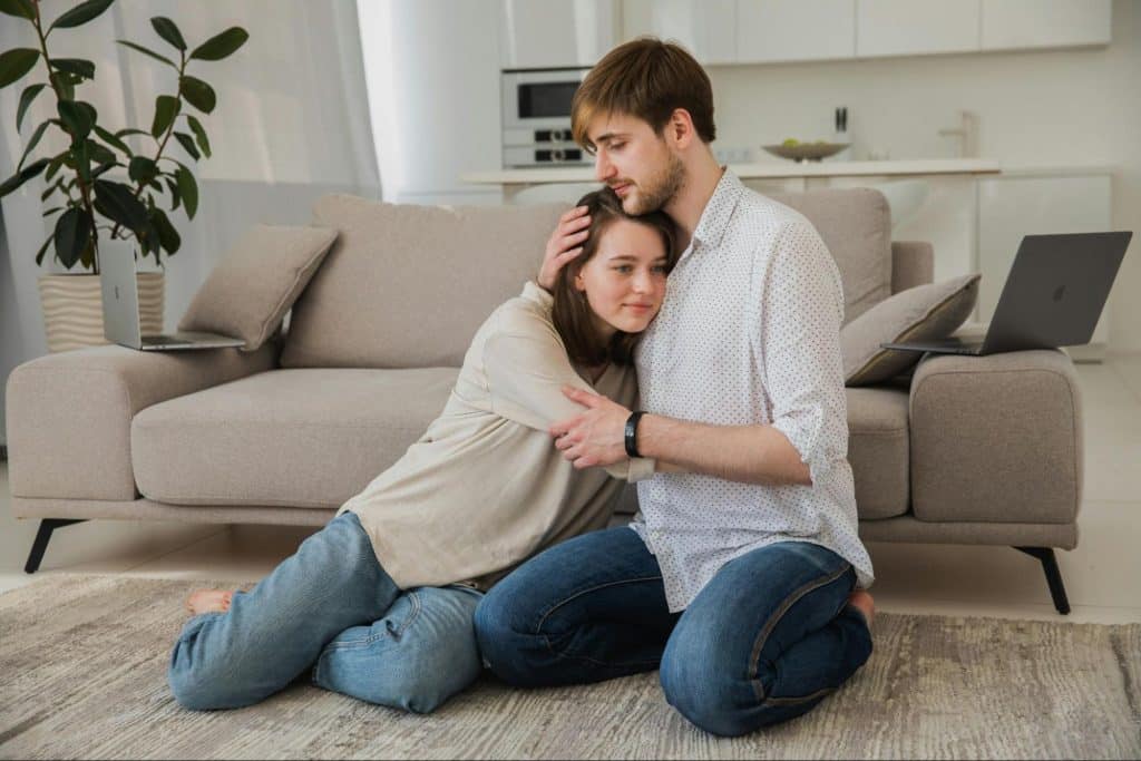 A man hugging a woman