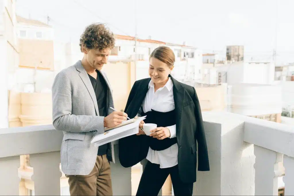 A man checking woman’s work
