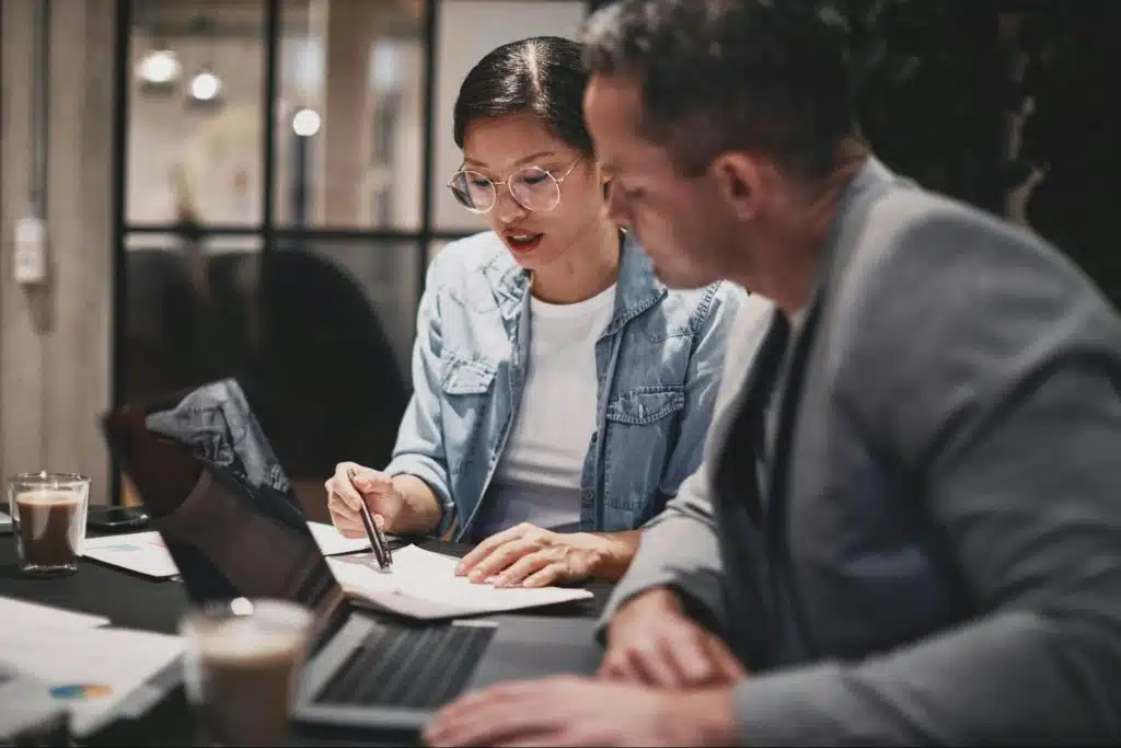 A man checking woman’s work