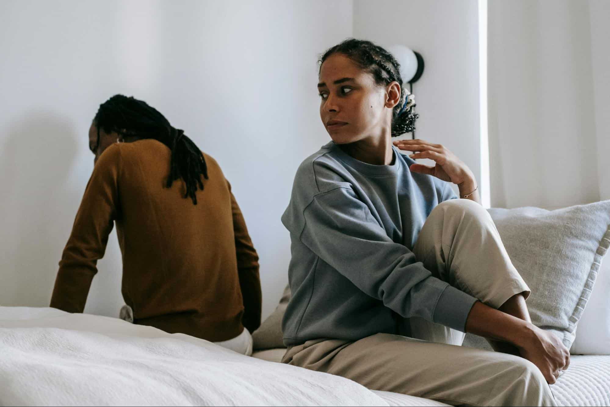 A man turning his back from a woman