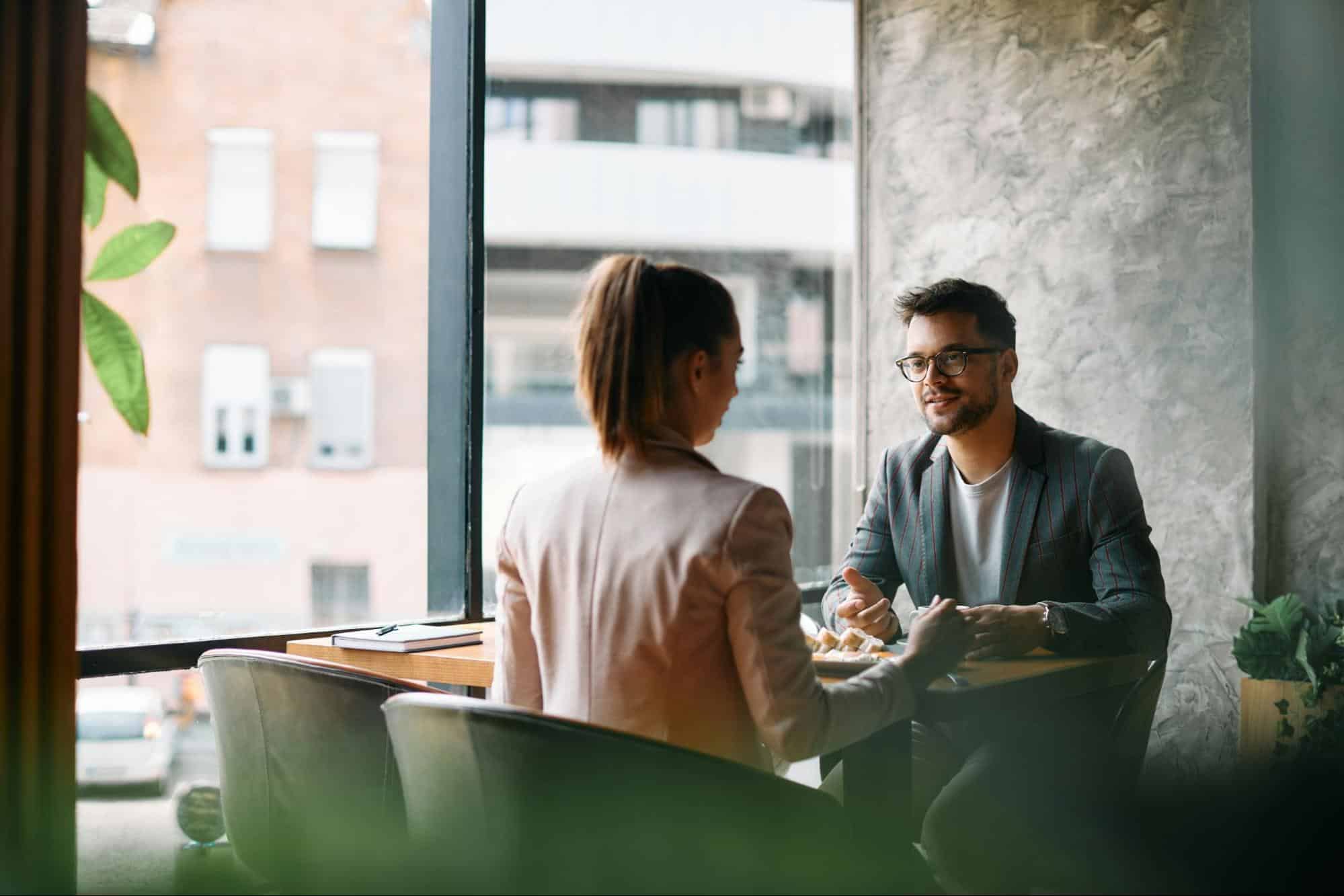A man talking to woman
