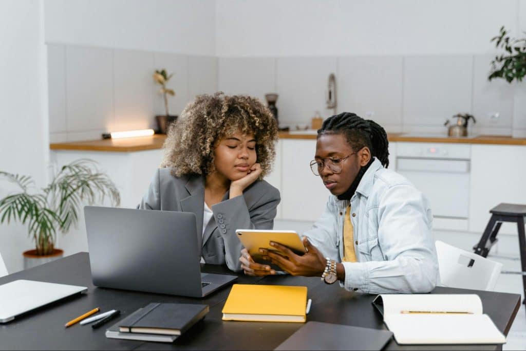 A man showing something to woman