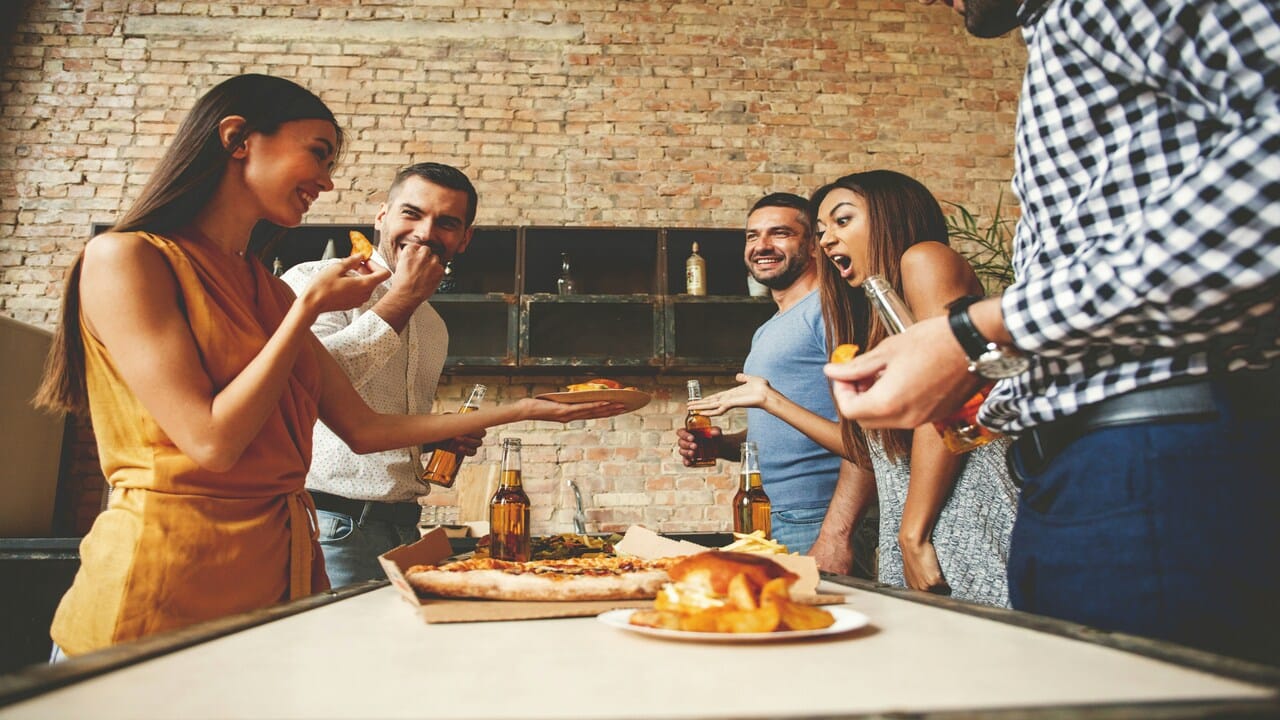 Friends having pizza together