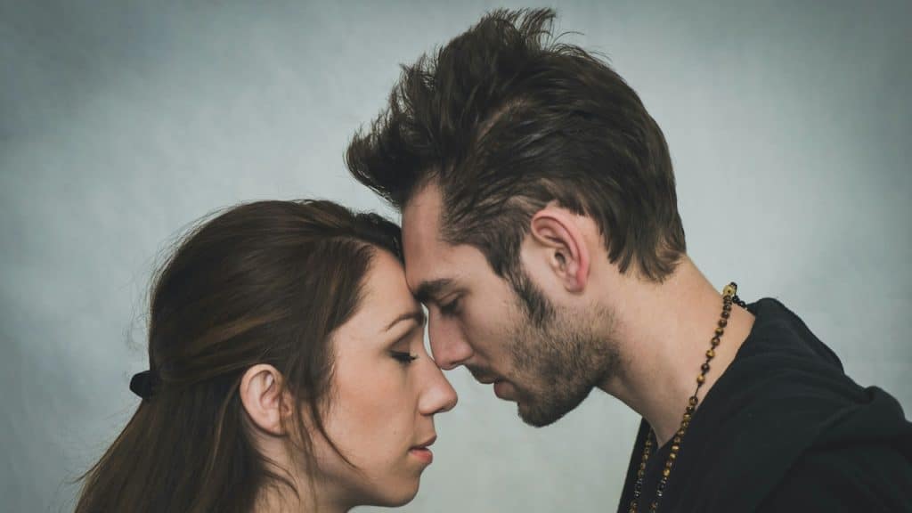 A man and a woman embracing each other.