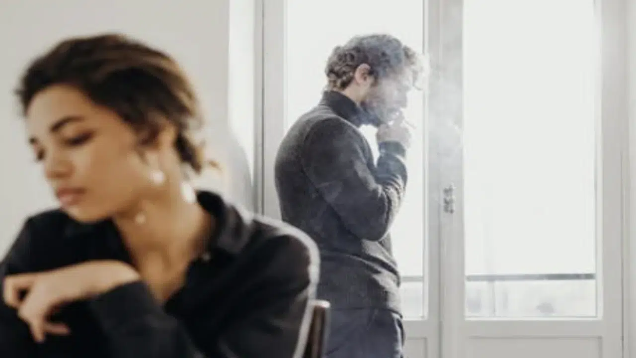 A couple ignoring each other at home
