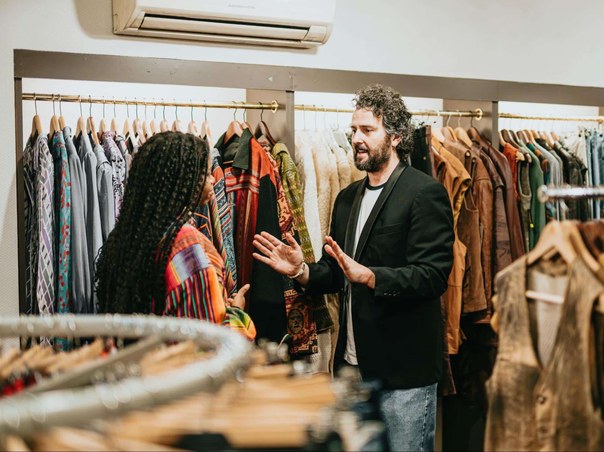 A man saying something to woman