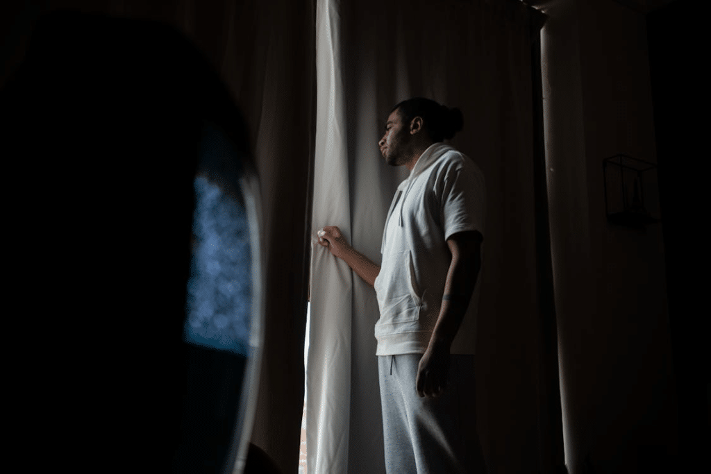 A man looking through the window