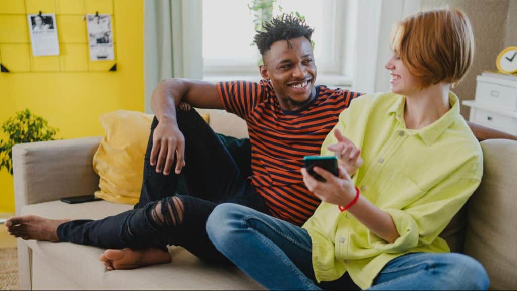 A man and woman at the couch