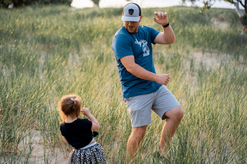 A man playing with a child