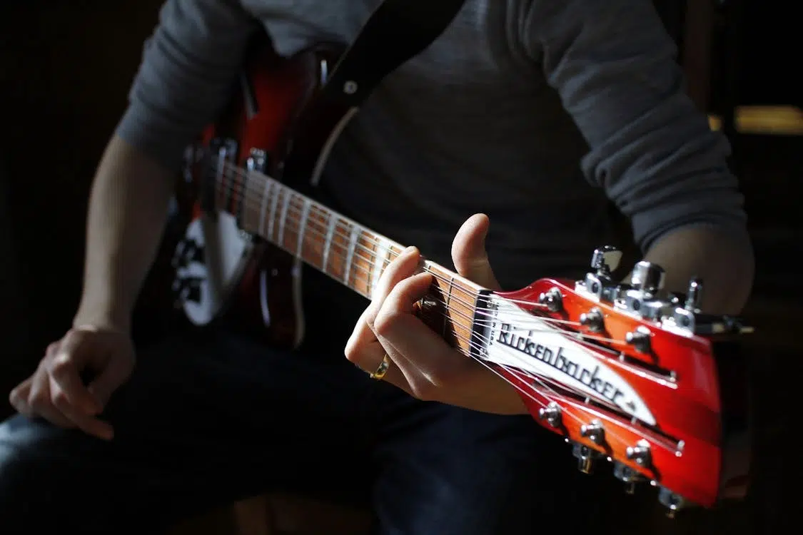 A man playing a guitar