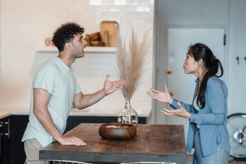 Couple in the kitchen arguing about chores