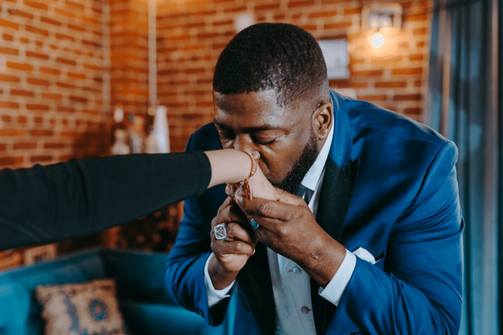 A man kissing a woman’s hand