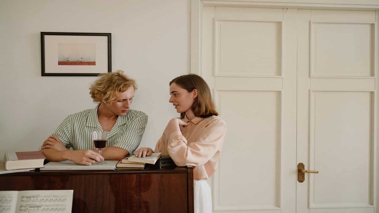 A couple having a serious talk at home