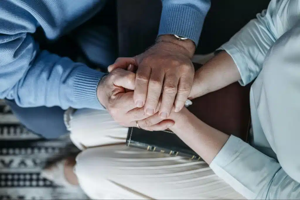 A man and woman holding hands