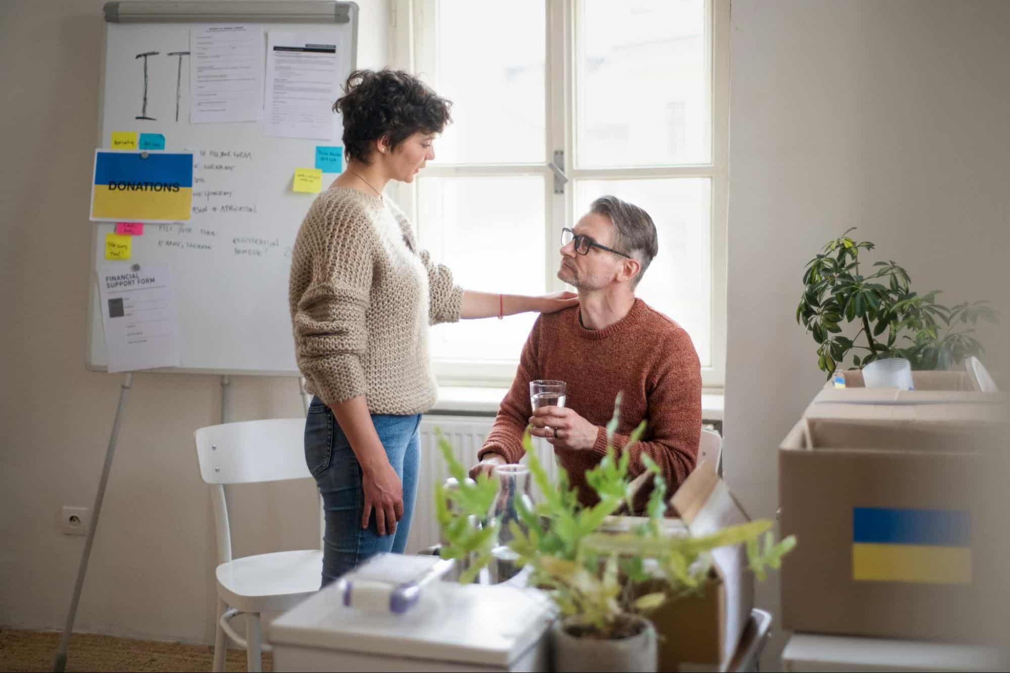  A man and woman looking at each other 