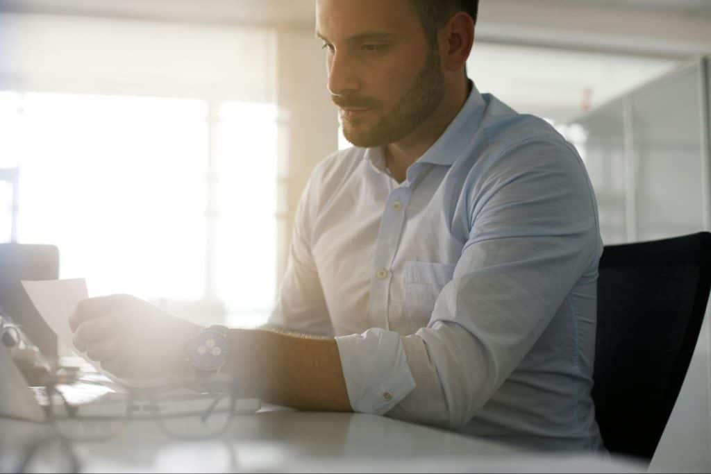 A man looking at the documents