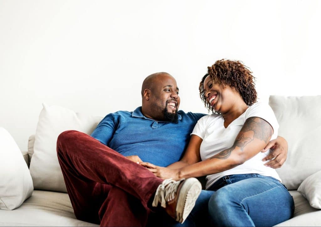 A man and woman on the couch
