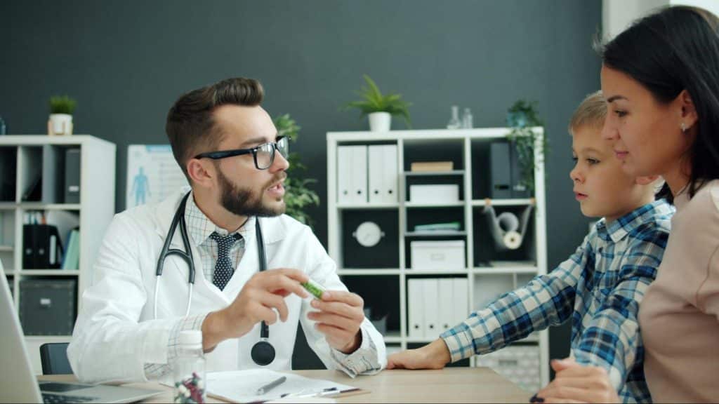 Woman with her child getting a doctor’s check-up