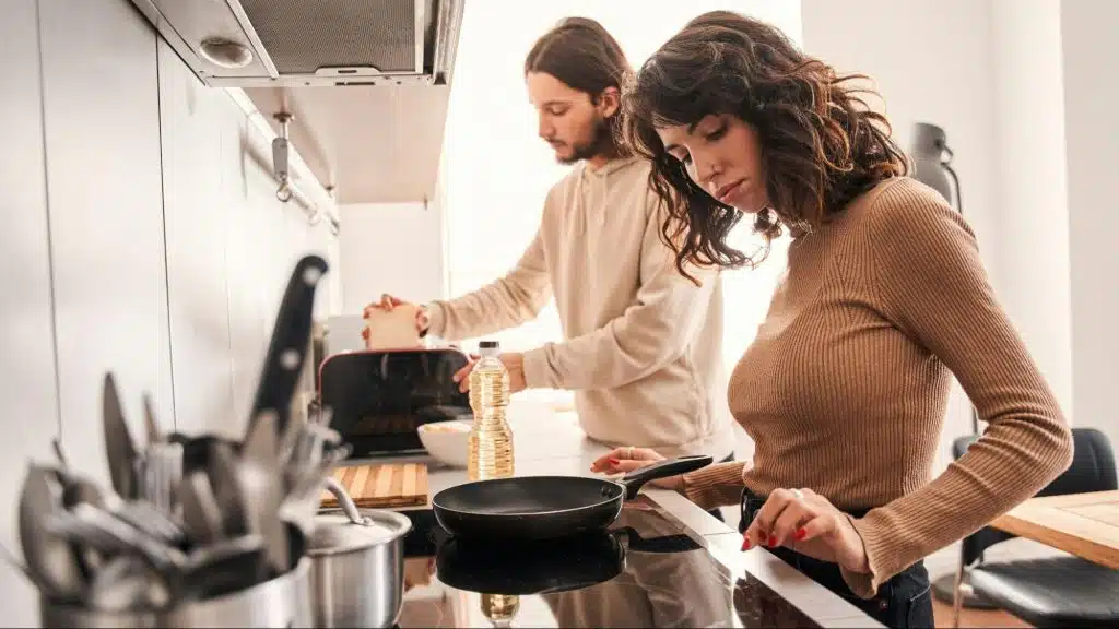 A man and woman at the kitchen