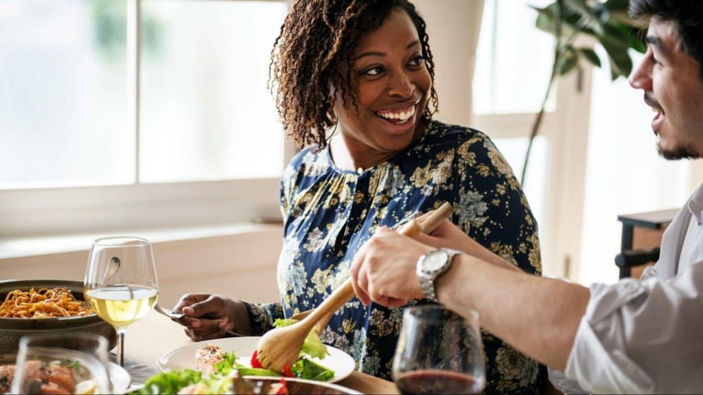 A man and woman smiling at each other