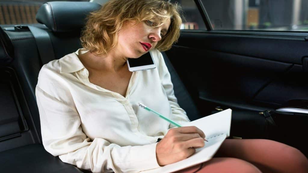 A woman busy in the car