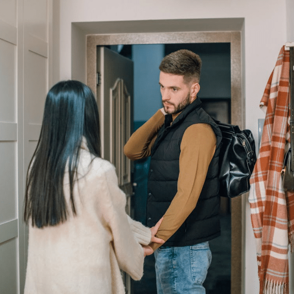 A man and a woman near the door
