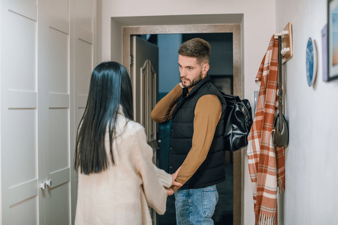 A man and a woman near the door
