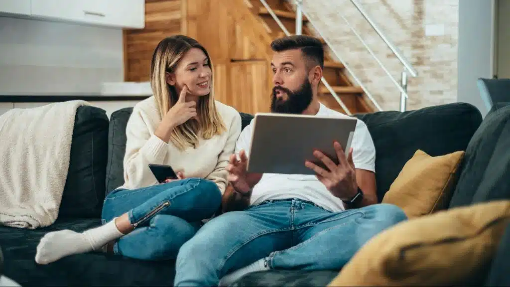 A man and woman at the couch during weekends