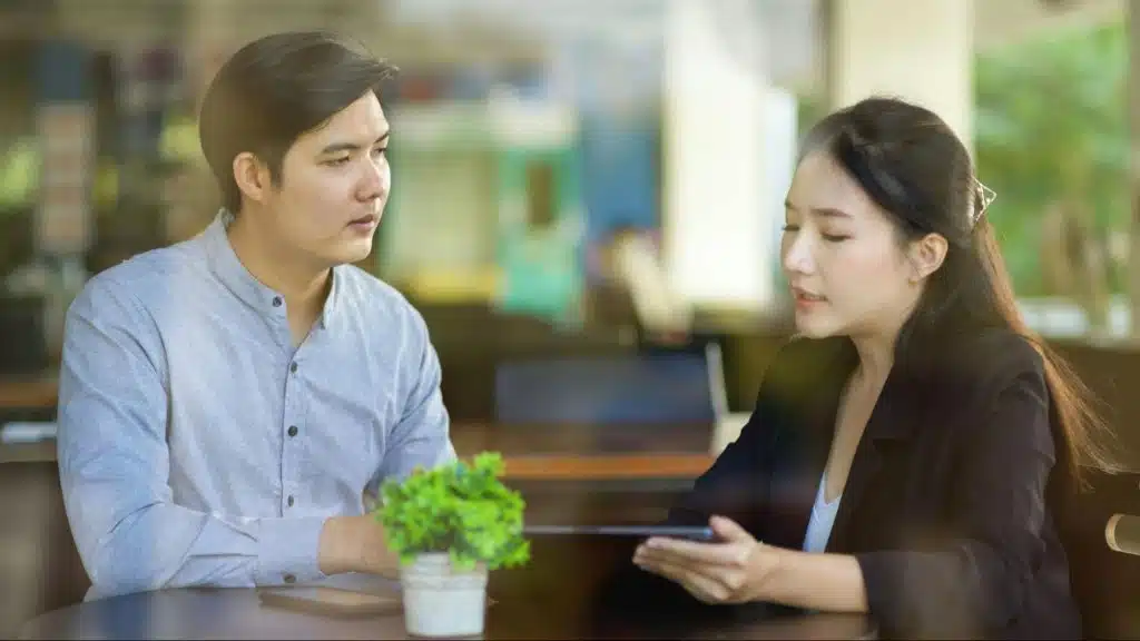 A man and woman having a serious conversation 