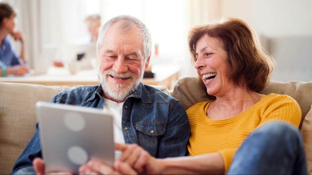 A man and woman smiling
