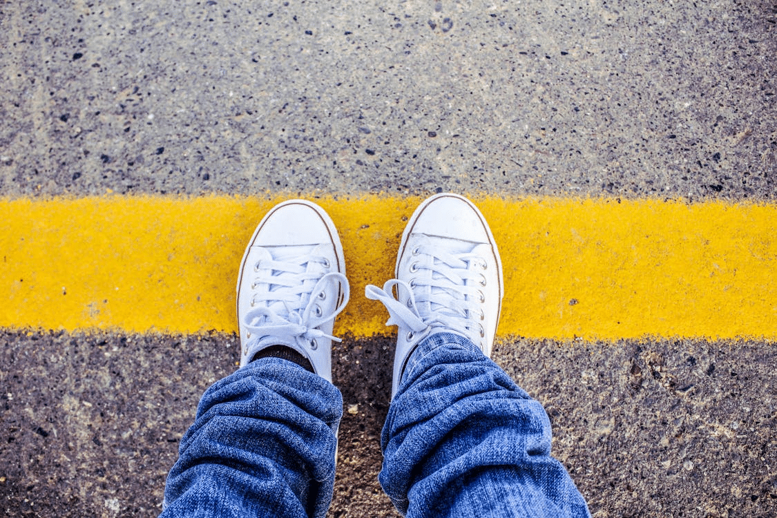 A man stepping on a line