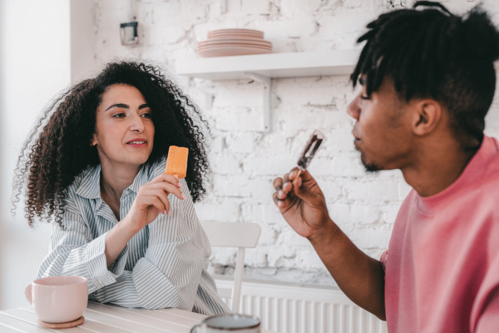 Man and Woman Eating Ice Cream Bar