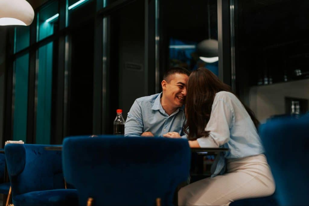 A man and woman being happy at the restaurant