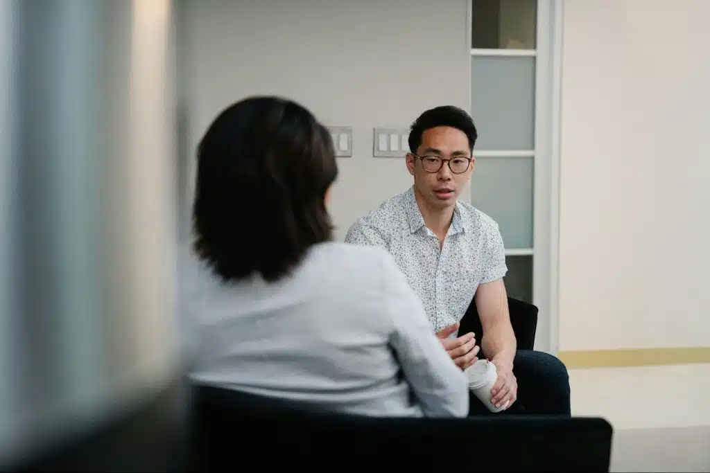 A man talking to woman