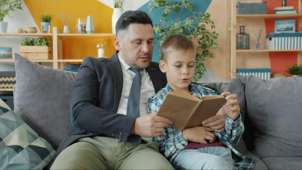 A man teaching his son