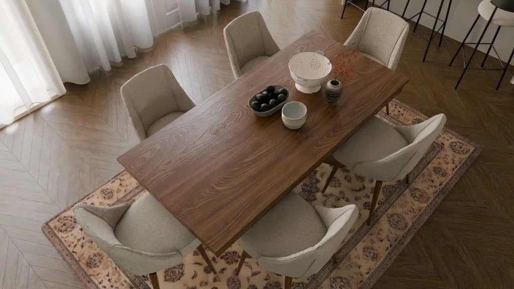 A dining room with a wooden table and chairs.