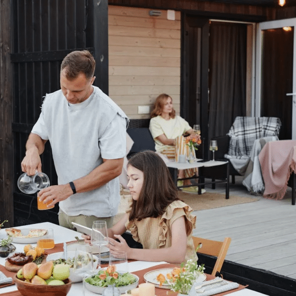 A family eating in their backyard
