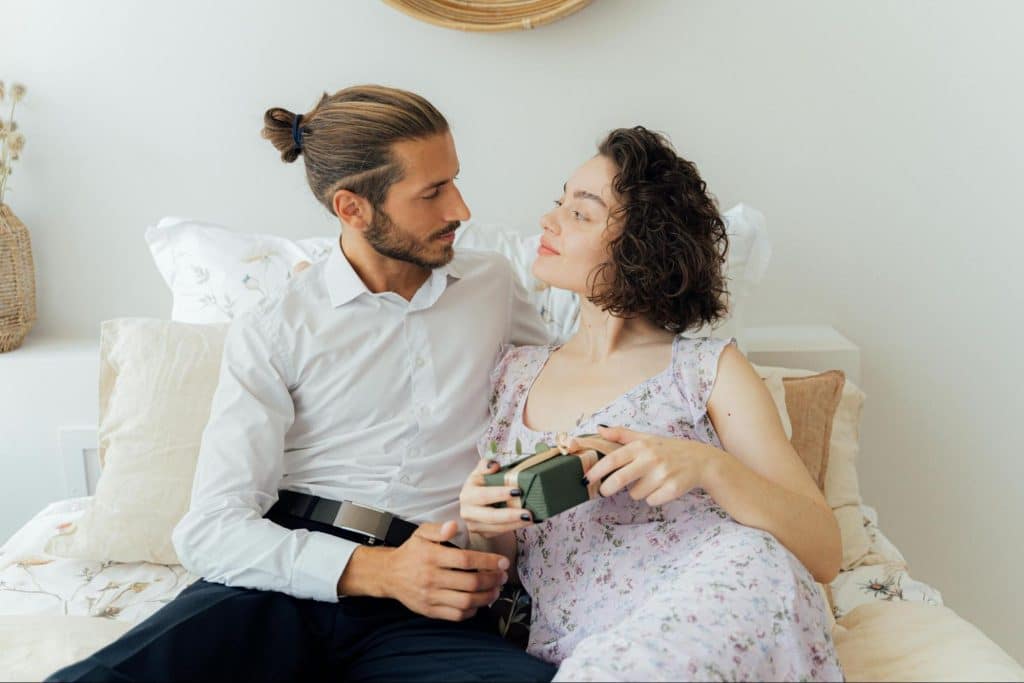 A man giving gift to woman