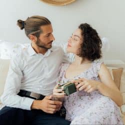 A man giving gift to woman