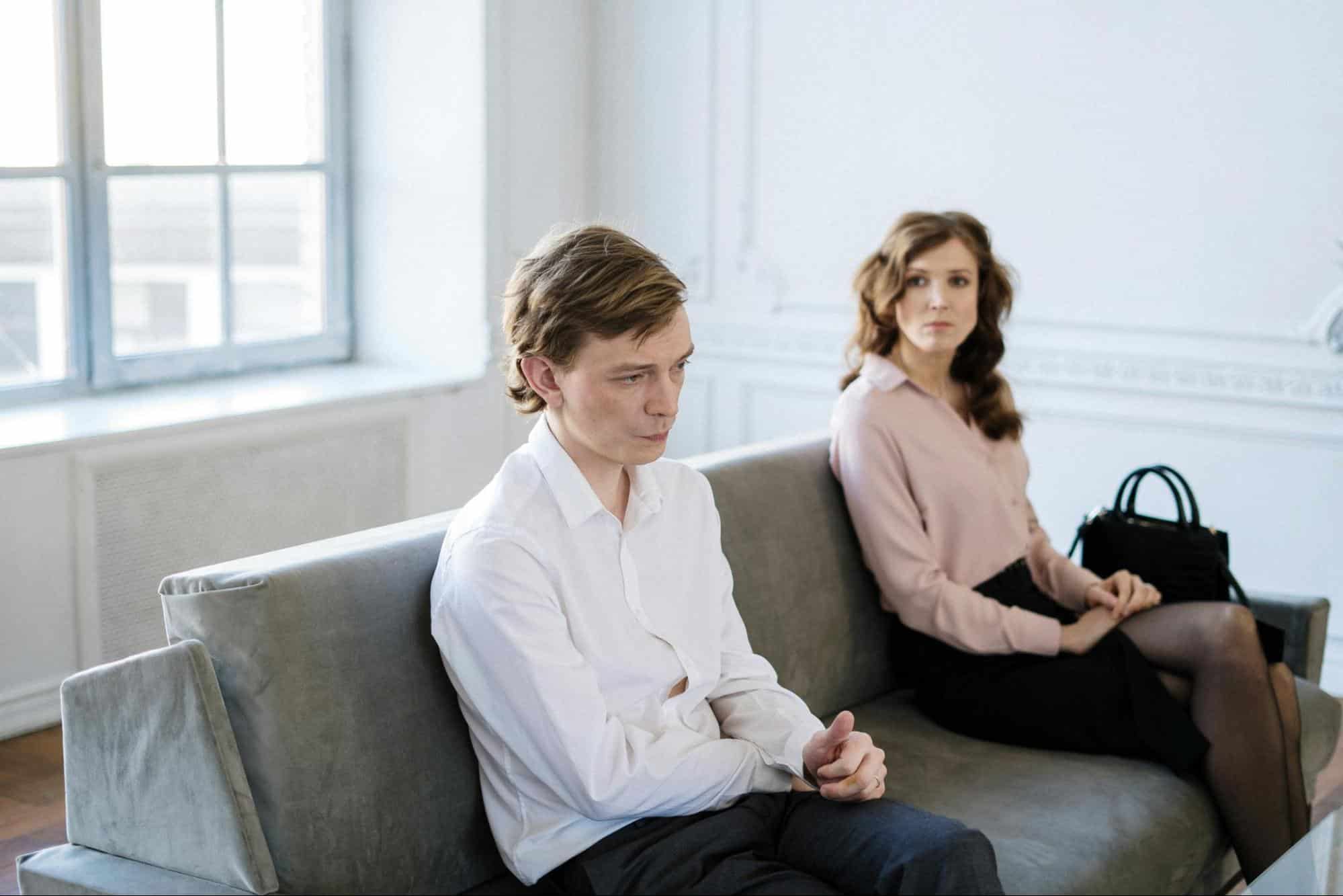 A woman looking at the man