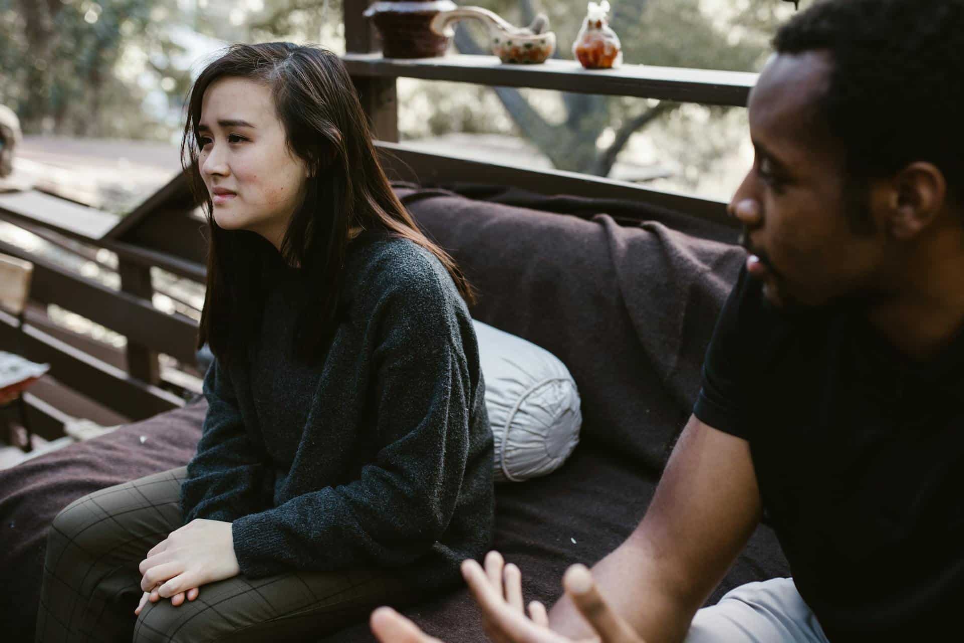 A woman crying beside a man