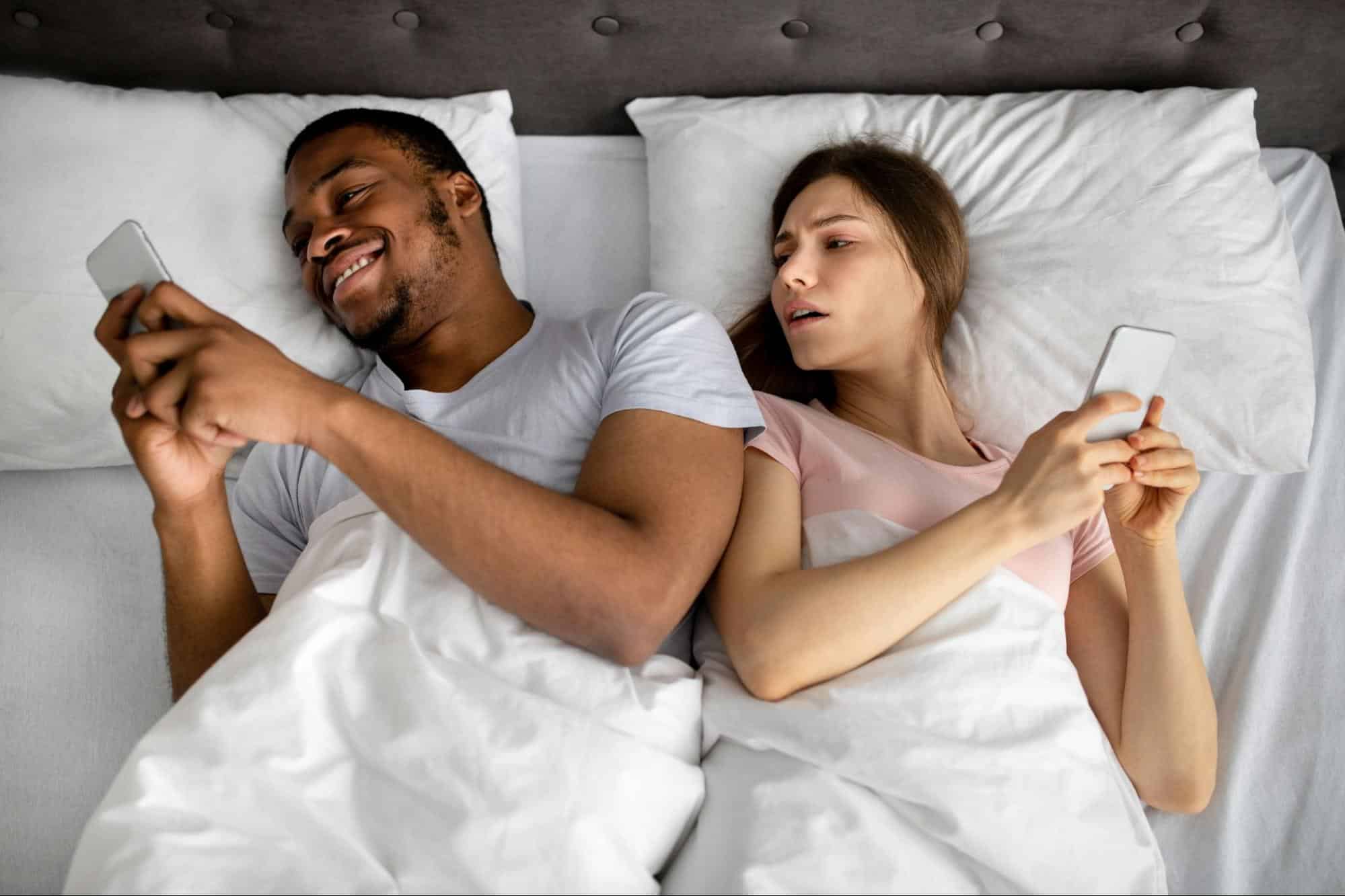 Woman looking at the man’s activity