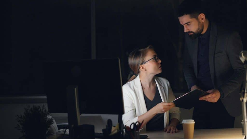 A woman talking to a man