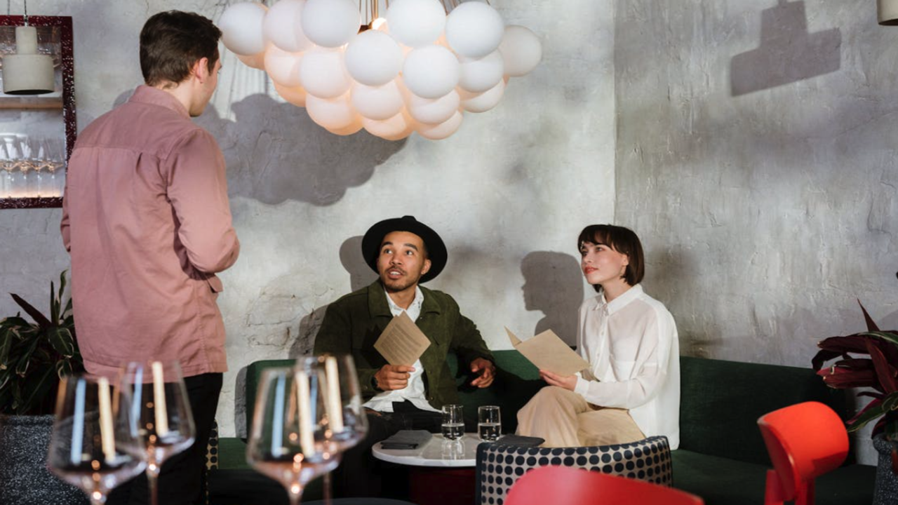 A couple talking to a waiter