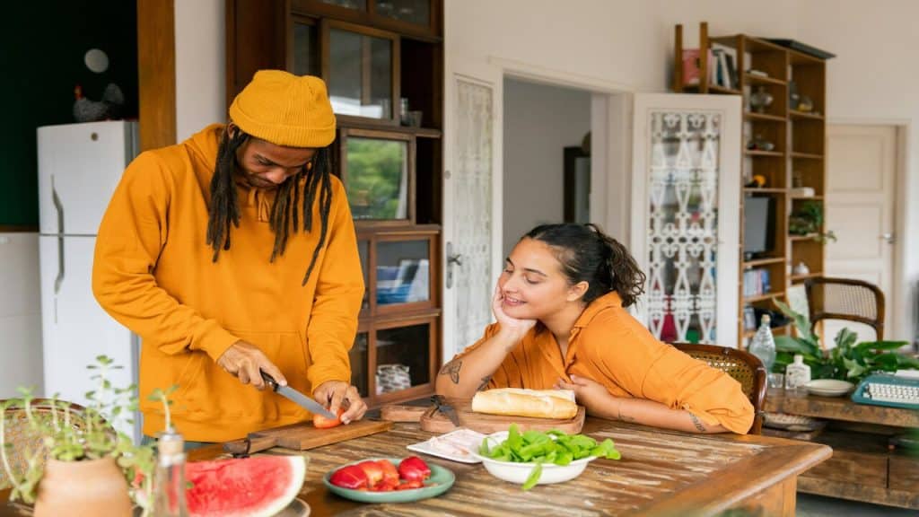 A couple preparing food together